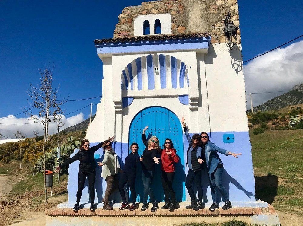 Friends at the blue gate of Chefchaouen